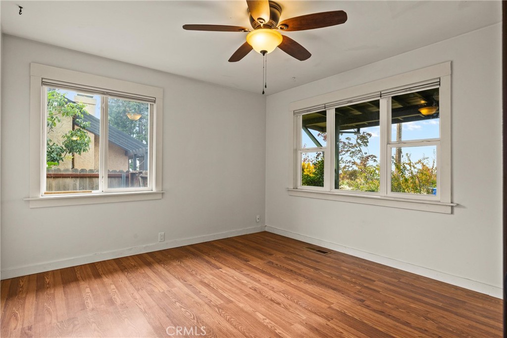 5416 Foster Road Paradise, CA 95969 - Photo 20 of 30 a view of an empty room with wooden floor and a window