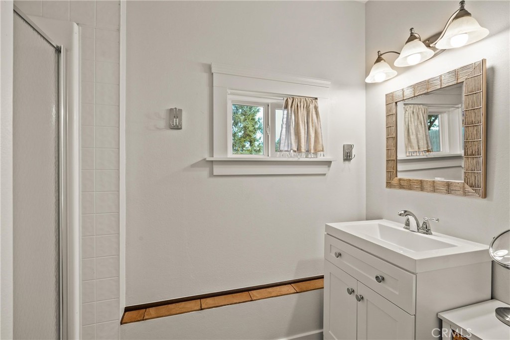 5416 Foster Road Paradise, CA 95969 - Photo 24 of 30 a bathroom with a sink and a mirror
