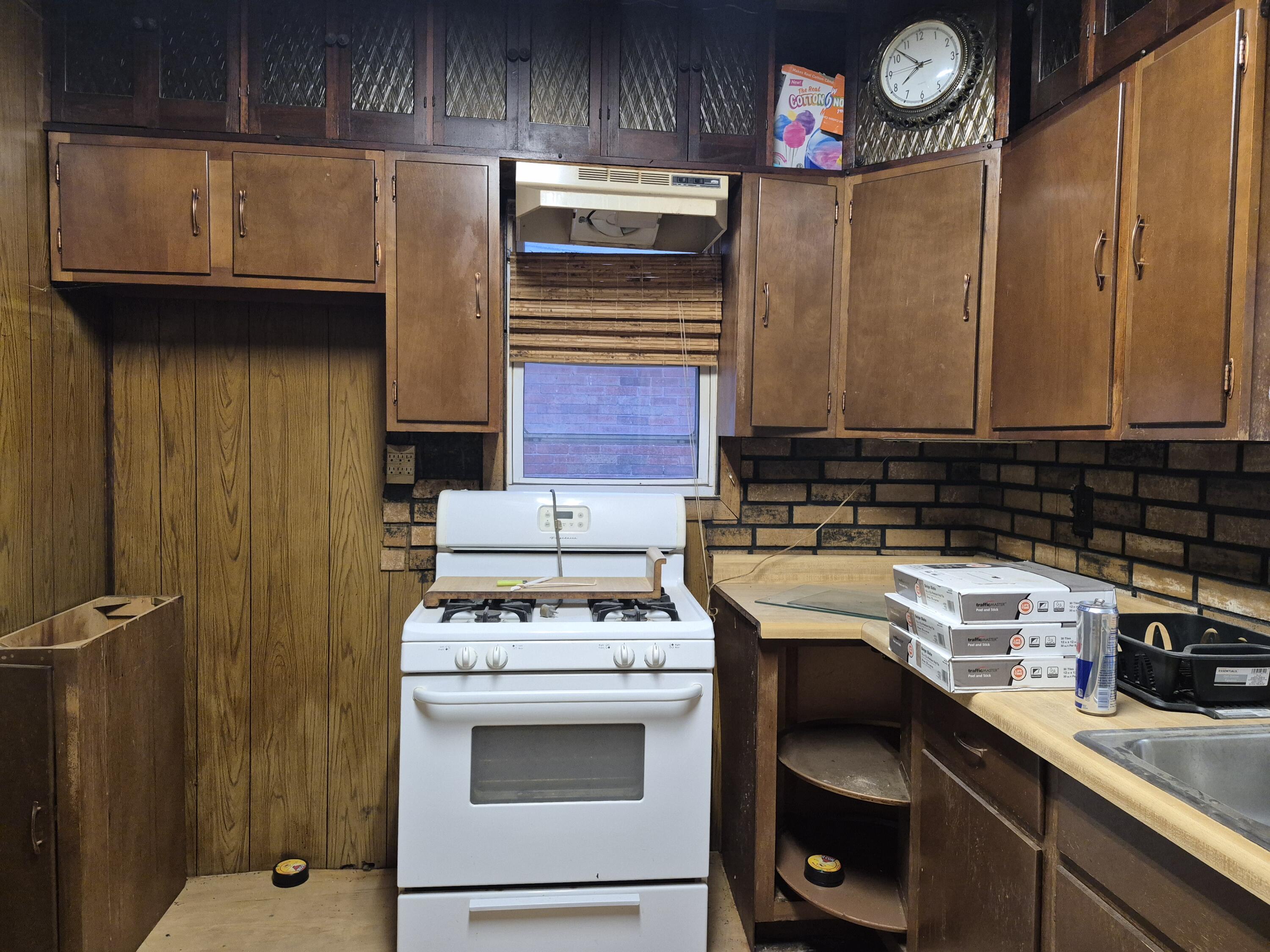 3724 Tyler Street Gary, IN 46408 - Photo 4 of 10 a kitchen with a stove and a microwave