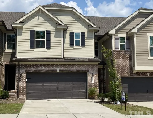 a front view of a house with a garage