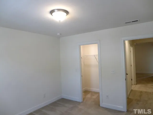 an empty room with a bathroom