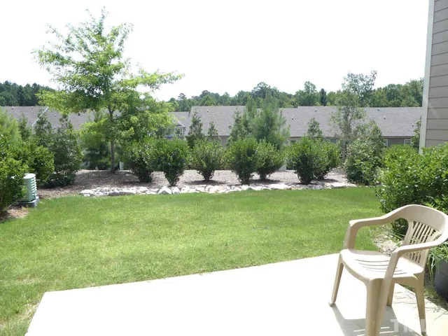 a view of a chairs and table in the garden
