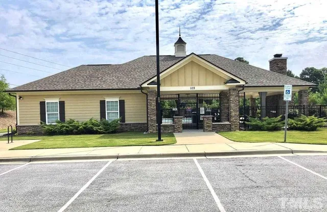 a room with gym equipment and large window