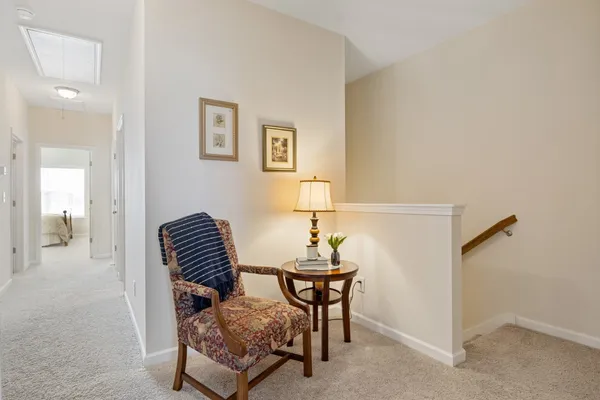 a living room with furniture and a chair