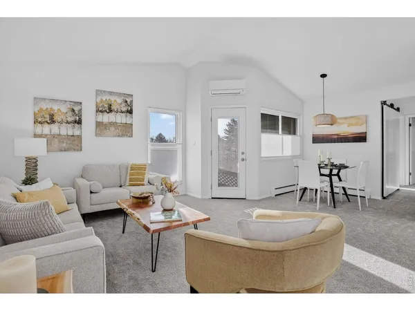 a living room with furniture and a table