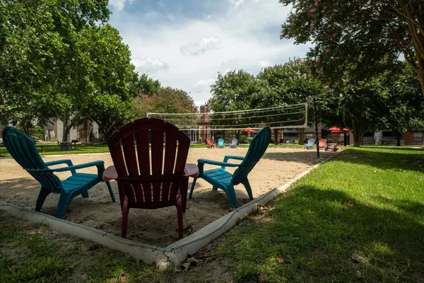 a kitchen with a stove and a wooden floor