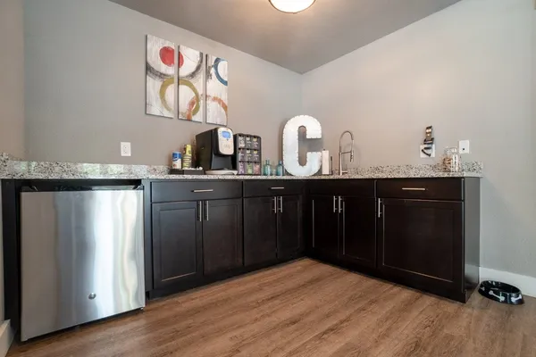 an empty room with a window and a mirror