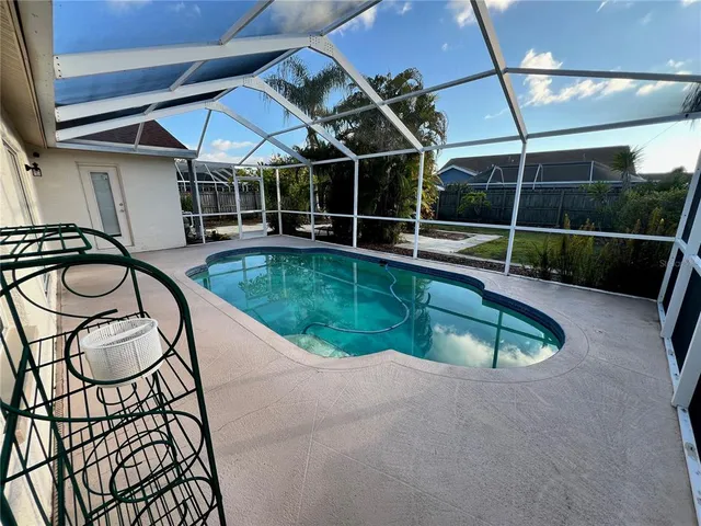 a view of a swimming pool with a patio