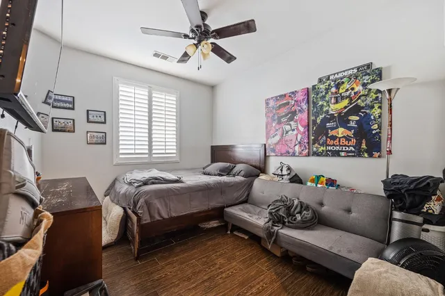 a bedroom with furniture and a window