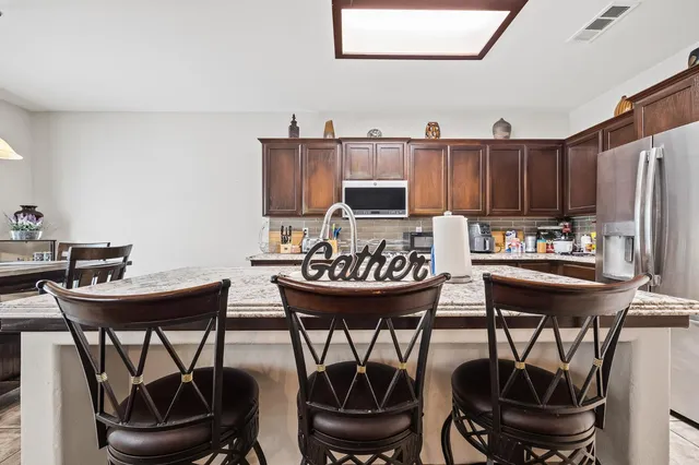 a kitchen with a table and chairs