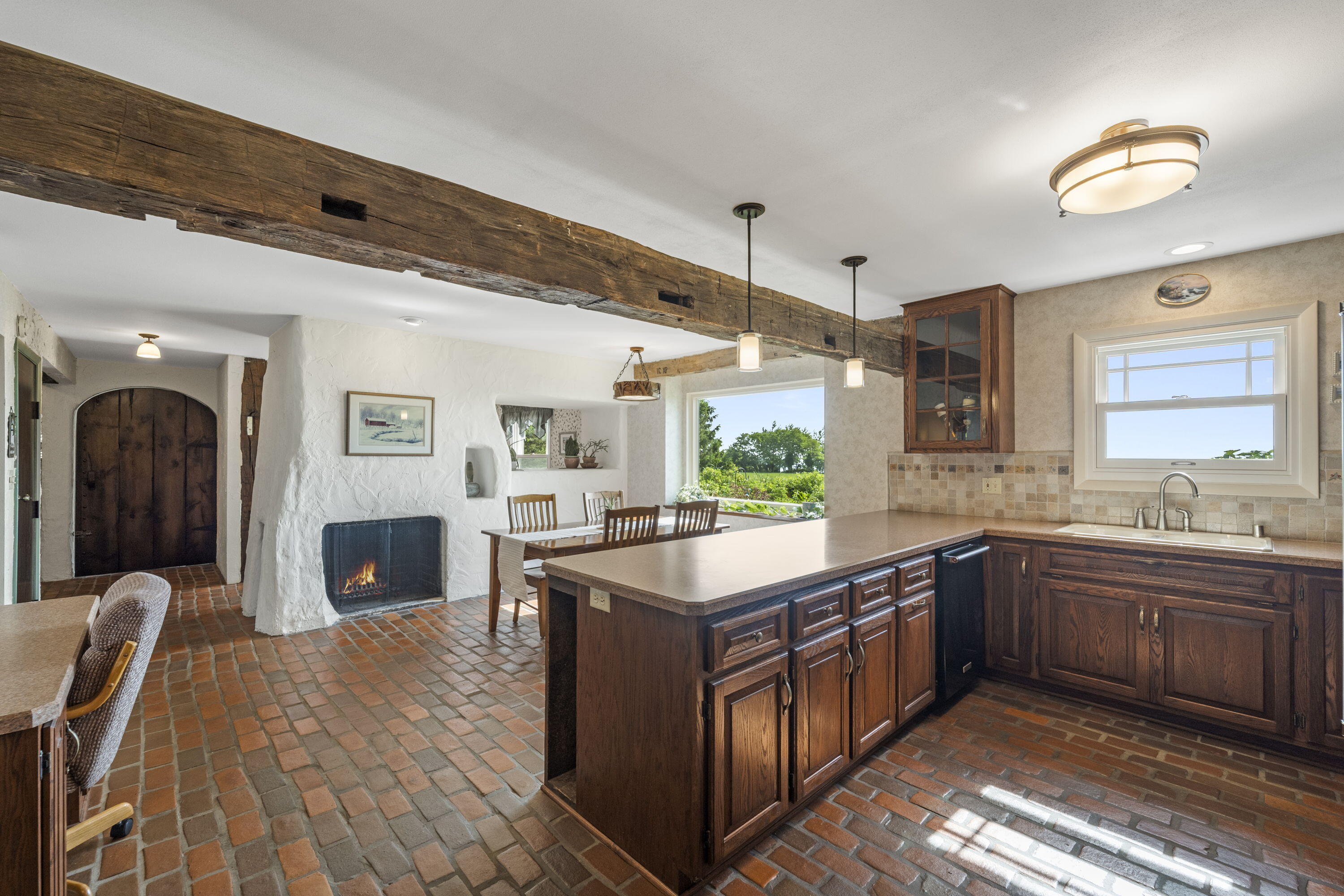 1270 Lake Shore Road Grafton, WI 53024 - Photo 26 of 99 From the cozy fireplace to the wood beams and brick flooring you will make memories in this fairy-tale setting!