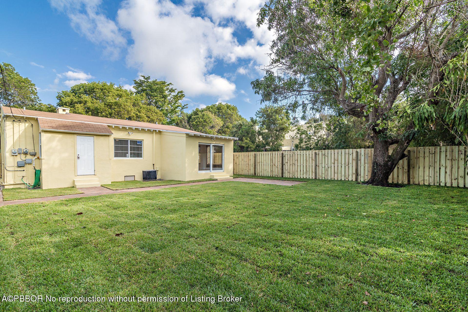 816 Sunset Road West Palm Beach, FL 33401 - Photo 16 of 22 a view of a backyard with a garden