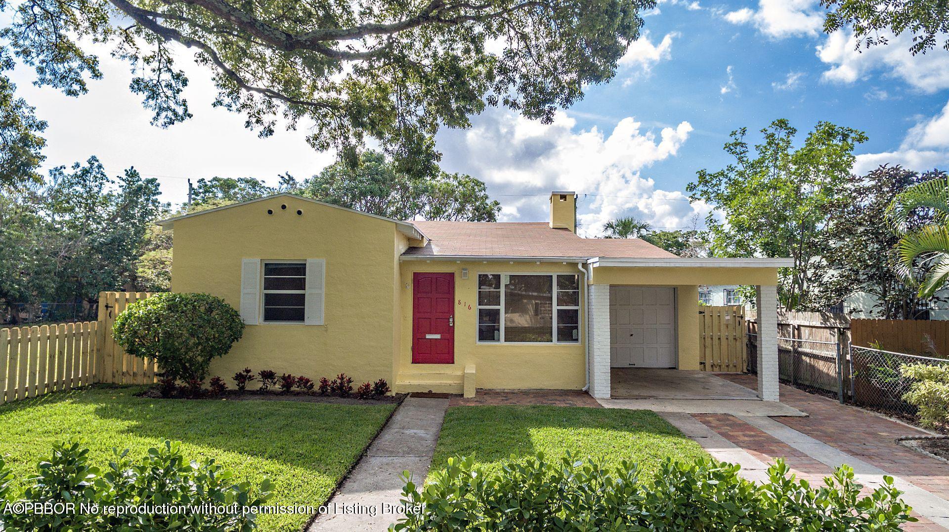 816 Sunset Road West Palm Beach, FL 33401 - Photo 18 of 22 a view of a house with yard and a garden