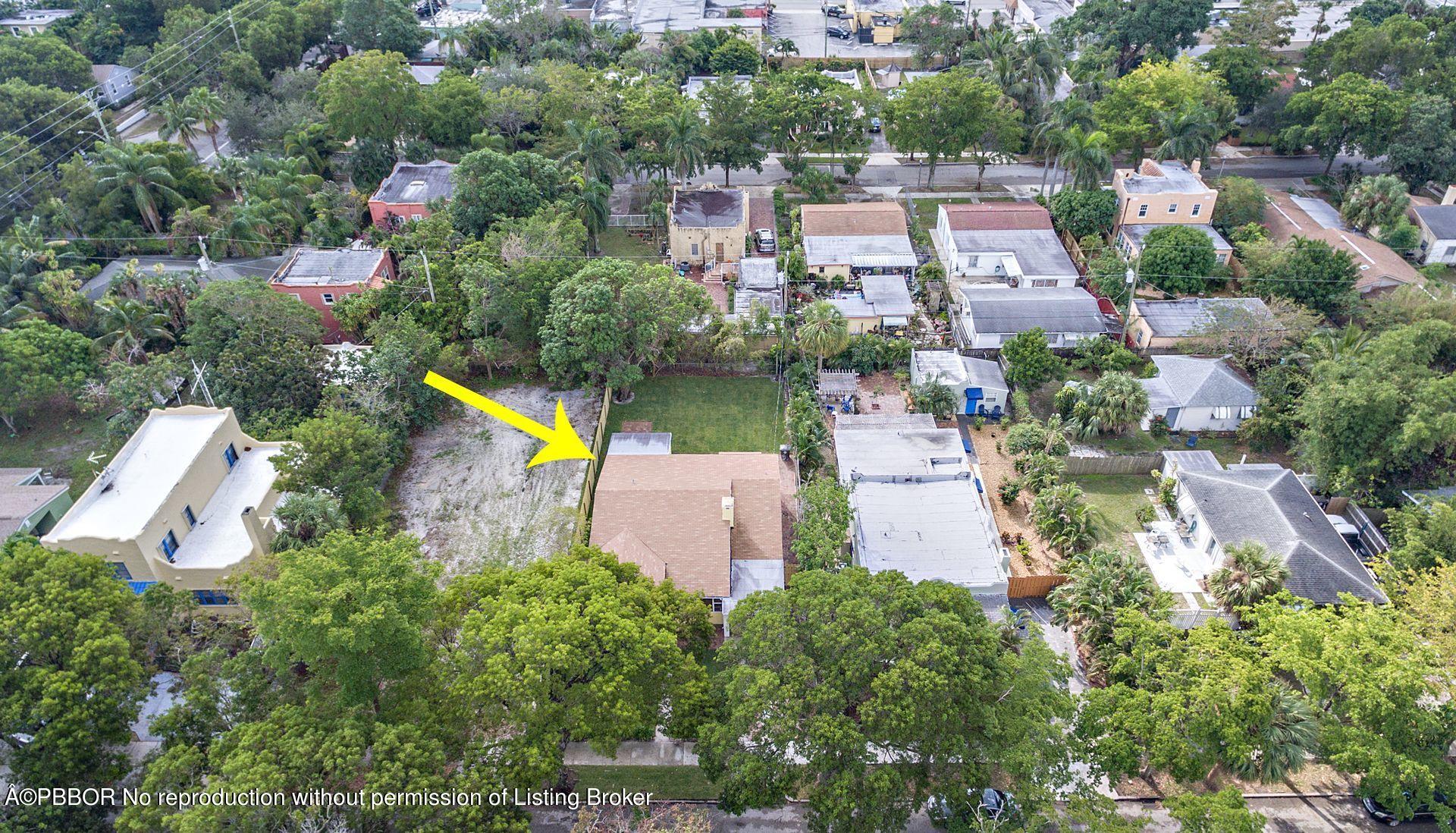 816 Sunset Road West Palm Beach, FL 33401 - Photo 20 of 22 an aerial view of a house with a yard and lake view
