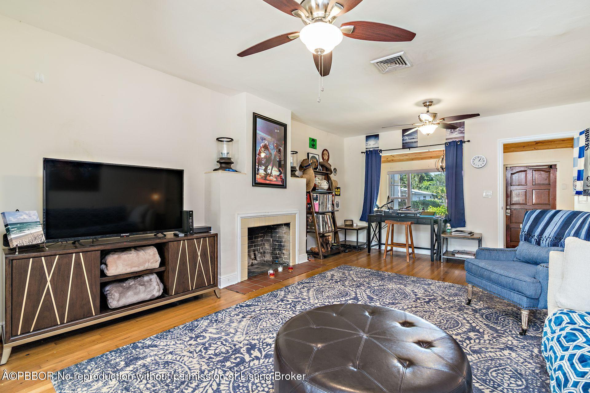 816 Sunset Road West Palm Beach, FL 33401 - Photo 6 of 22 a living room with furniture and a flat screen tv