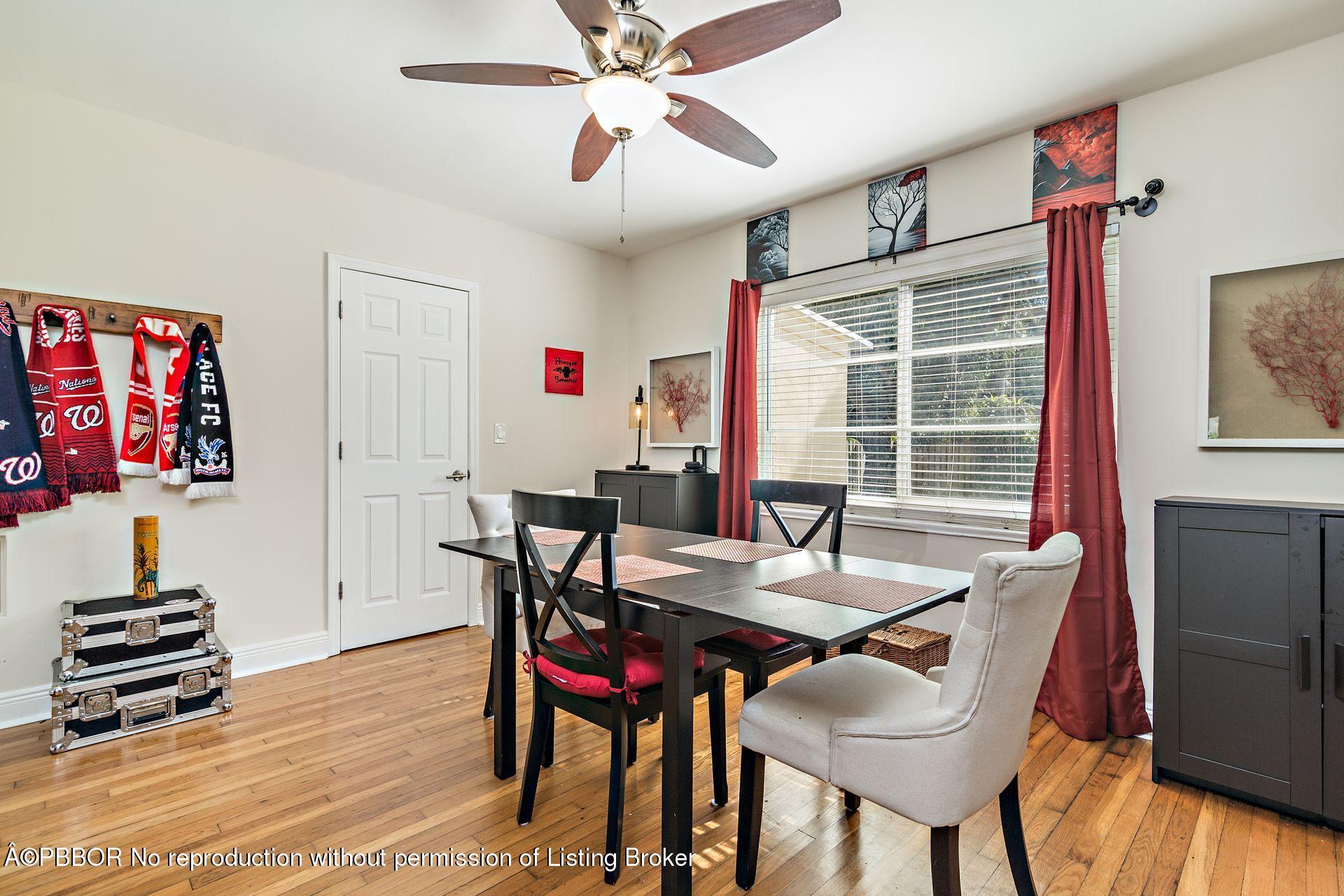 816 Sunset Road West Palm Beach, FL 33401 - Photo 7 of 22 a view of a dining room with furniture window and wooden floor