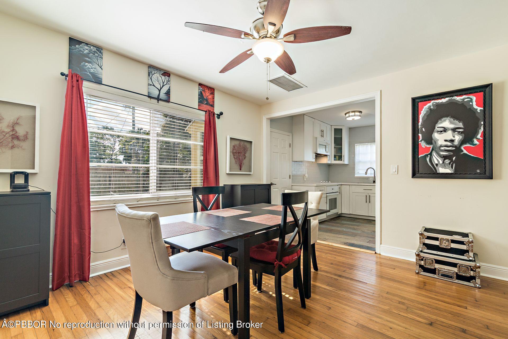 816 Sunset Road West Palm Beach, FL 33401 - Photo 8 of 22 a view of a dining room with furniture window and wooden floor