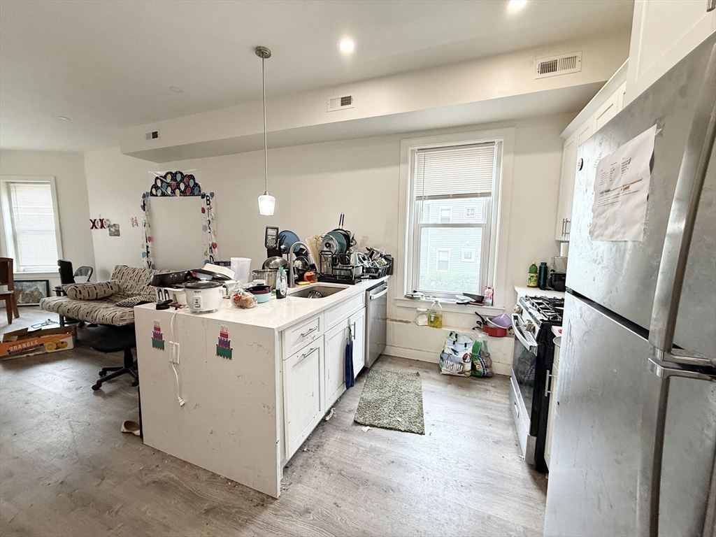 a view of living room with furniture and a window