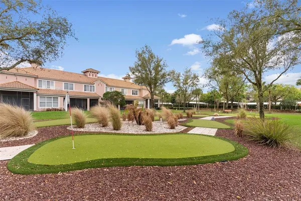 a view of a house with a backyard