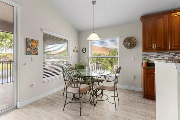 a dining room with furniture window wooden floor