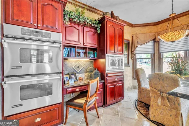 a front view of a house with a yard outdoor seating and covered with trees