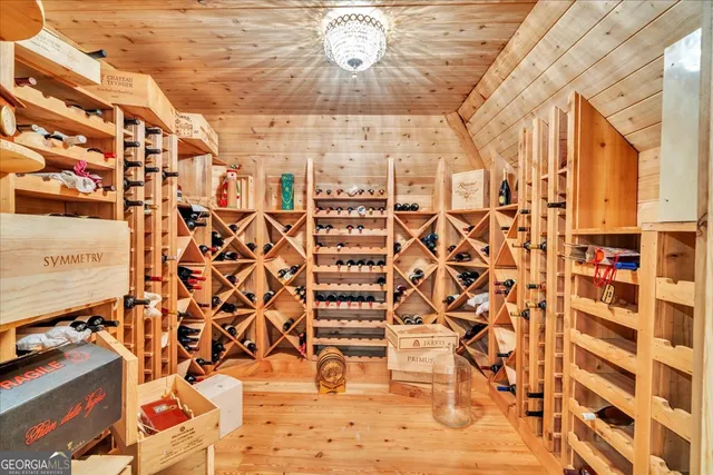 a view of a dining room with furniture wooden floor and chandelier