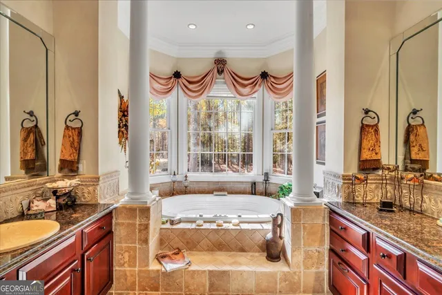 a view of a kitchen with stainless steel appliances granite countertop a refrigerator and a stove