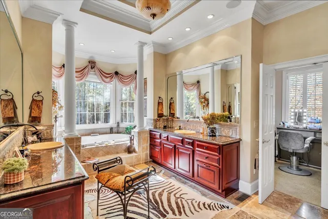 a view of a dining room with furniture a chandelier and wooden floor