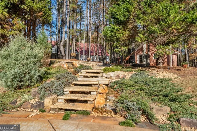 a view of a porch with furniture and a yard