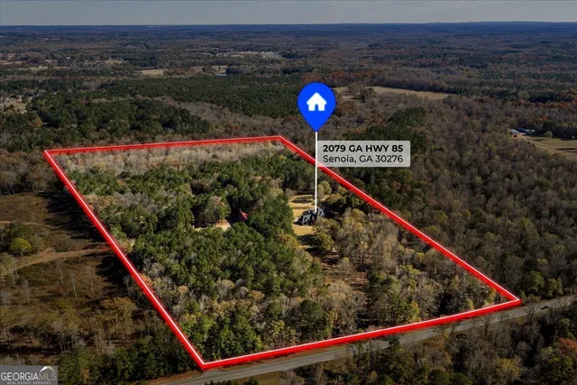 a view of a dining room with furniture wooden floor and chandelier