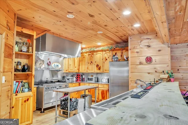 a view of a livingroom with furniture and a window