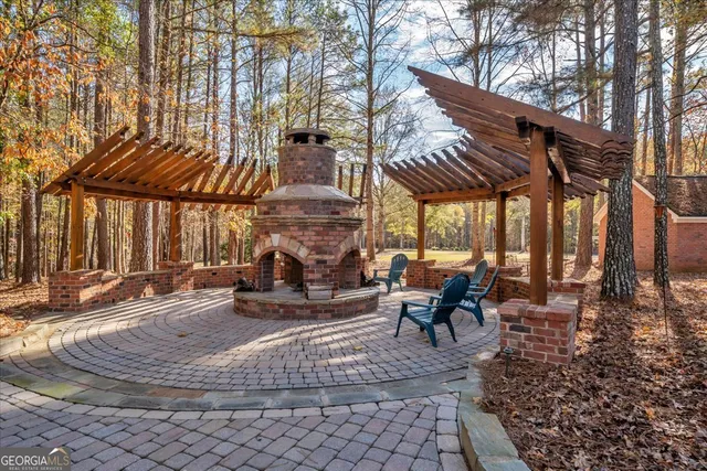 a living room with furniture a couch and a large window
