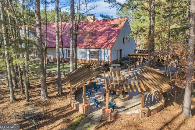 a view of staircase with white walls and a dining table
