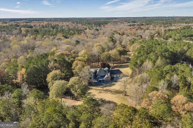 a bathroom with a sink toilet and mirror