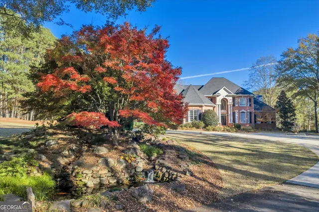a kitchen with stainless steel appliances granite countertop a stove and a microwave