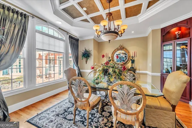 a living room with furniture ceiling fan and a flat screen tv