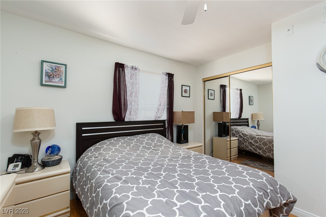 231 West Horizon Ridge Parkway, Unit 1126 Henderson, NV 89012 - Photo 11 of 33 Bedroom featuring a closet, wood finished floors, and ceiling fan