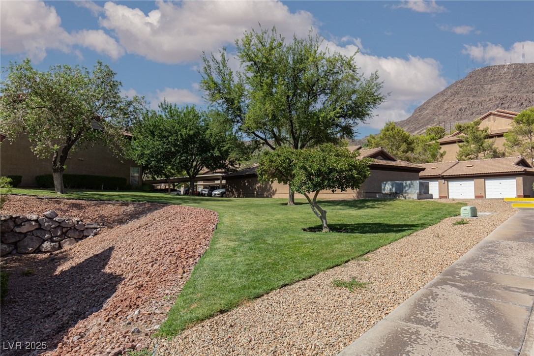 231 West Horizon Ridge Parkway, Unit 1126 Henderson, NV 89012 - Photo 22 of 33 View of grassy yard with a mountain view