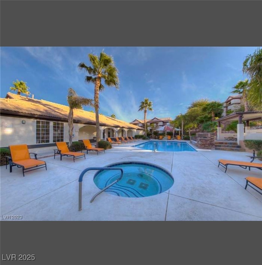 231 West Horizon Ridge Parkway, Unit 1126 Henderson, NV 89012 - Photo 29 of 33 Community pool featuring a community hot tub and a patio area