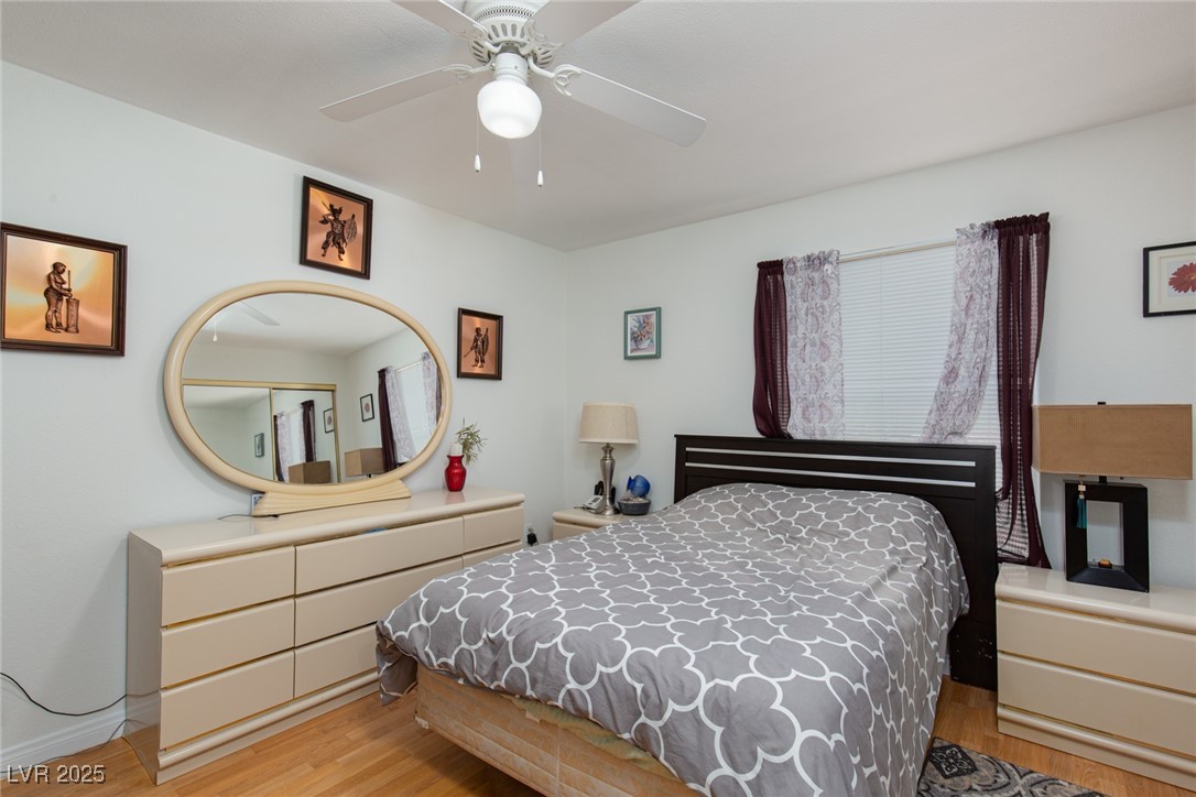 231 West Horizon Ridge Parkway, Unit 1126 Henderson, NV 89012 - Photo 10 of 33 Bedroom featuring light wood-style floors and ceiling fan