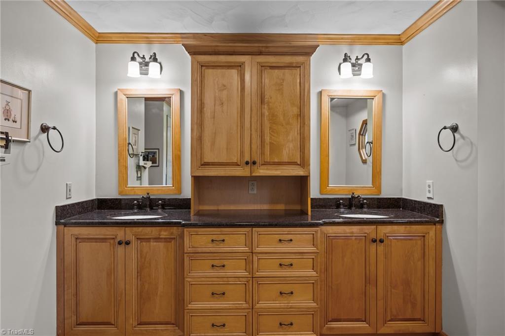 1498 Bethesda Road Lexington, NC 27295 - Photo 26 of 40 Spacious Primary En-Suite with Dual Vanities