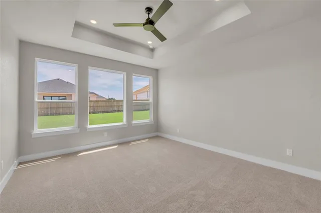 an empty room with a empty space and windows