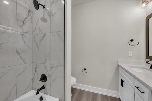 a bathroom with a double vanity sink mirror and