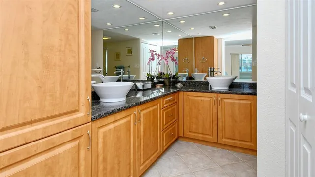 a bathroom with a sink a mirror and a bathtub