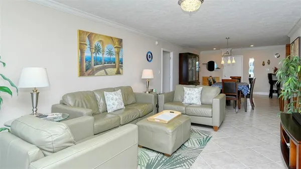 a living room with furniture and a lamp