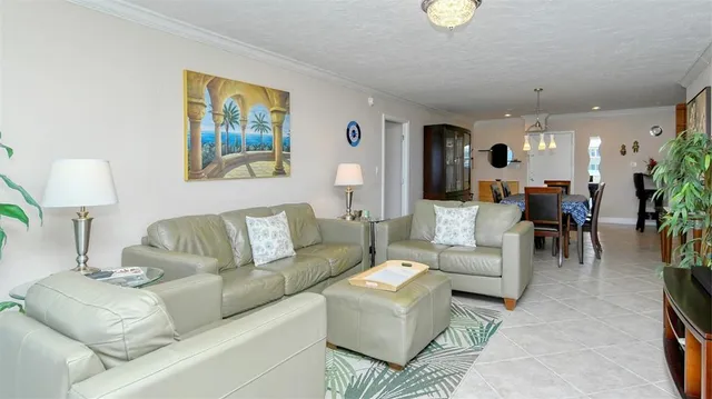 a living room with furniture and a lamp