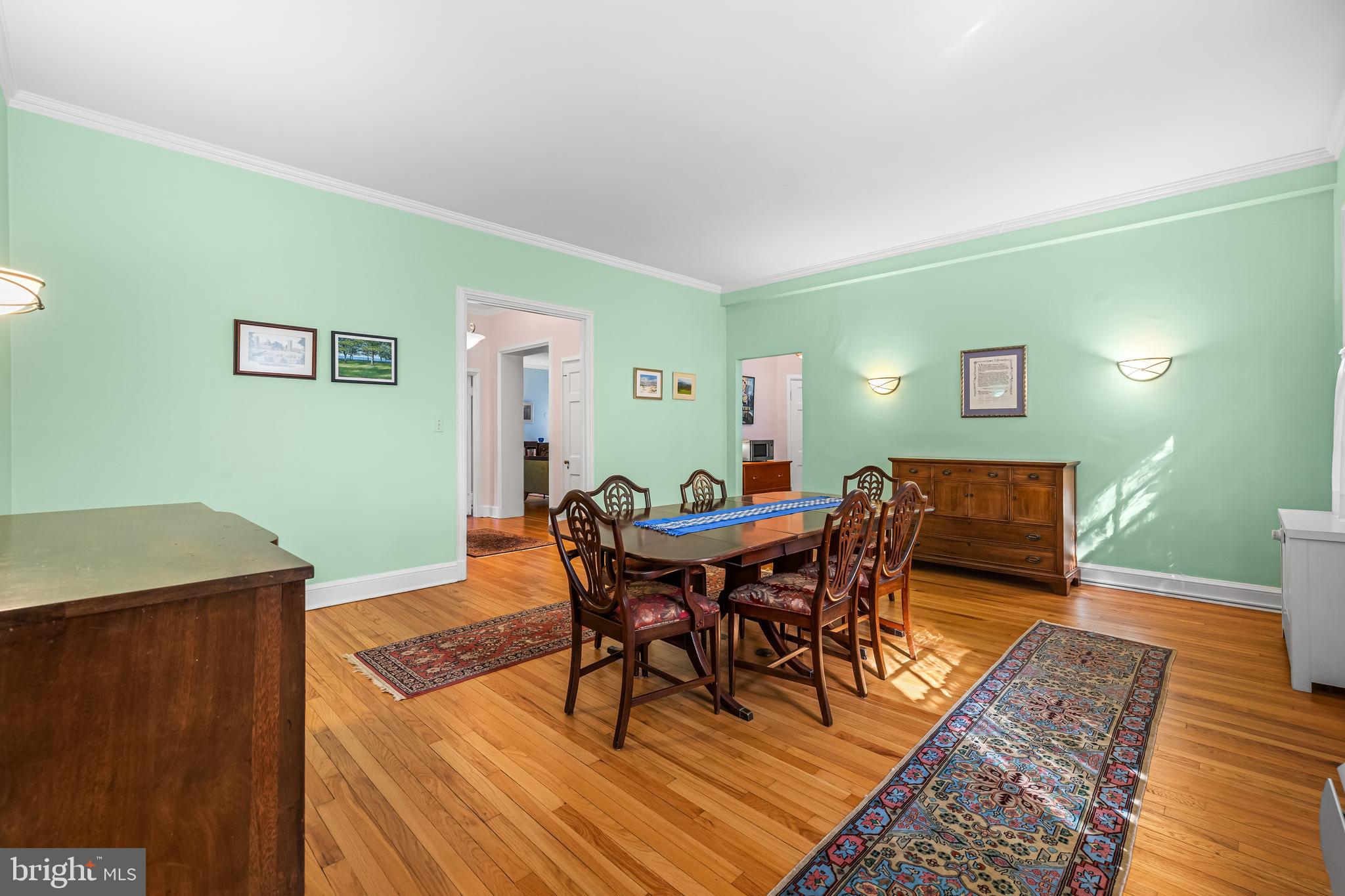 6 Upland Road, Unit F1 Baltimore, MD 21210 - Photo 13 of 50 a view of a dining room with furniture and wooden floor