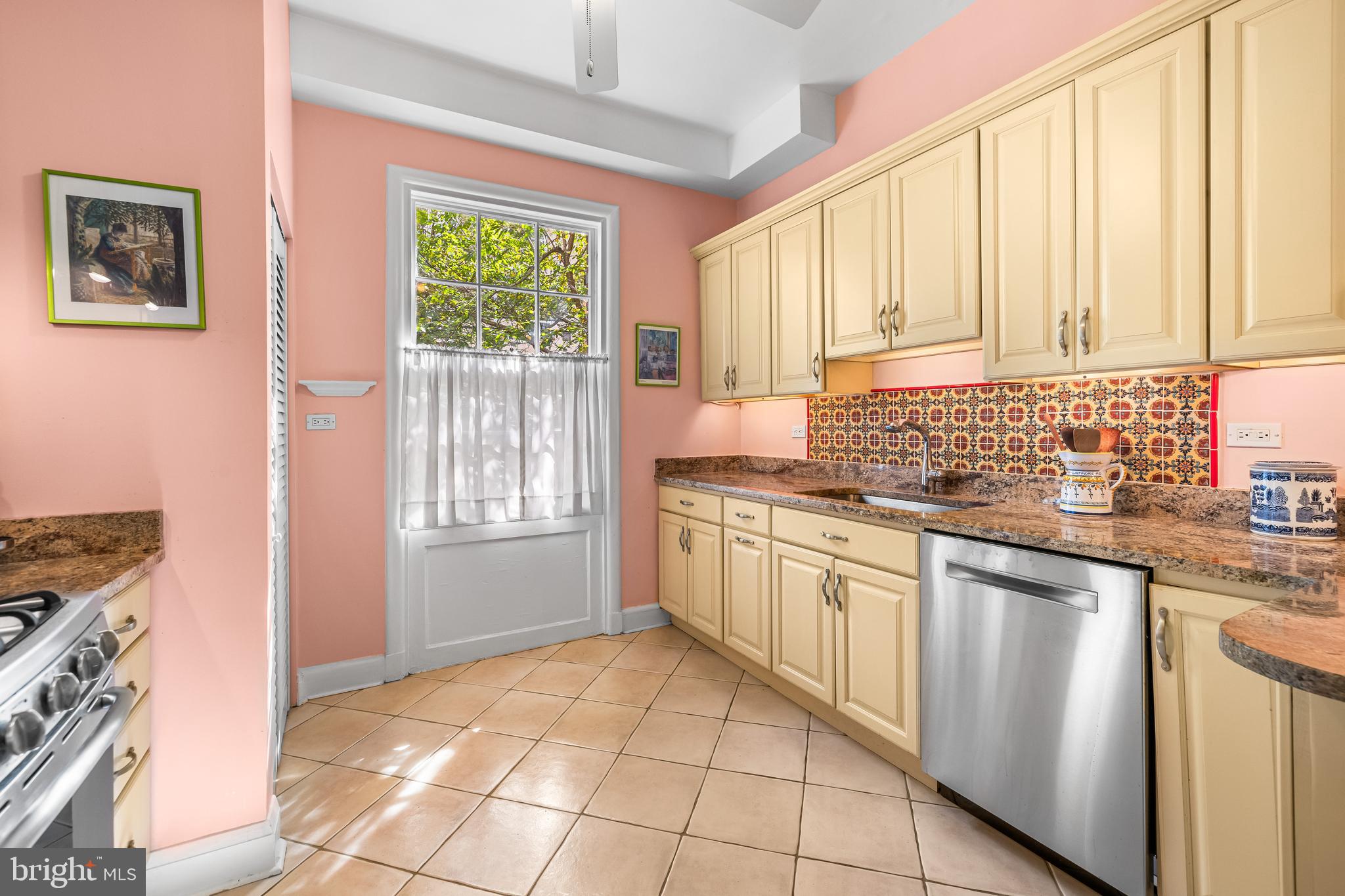 6 Upland Road, Unit F1 Baltimore, MD 21210 - Photo 19 of 50 a kitchen with stainless steel appliances granite countertop a stove a sink and a microwave