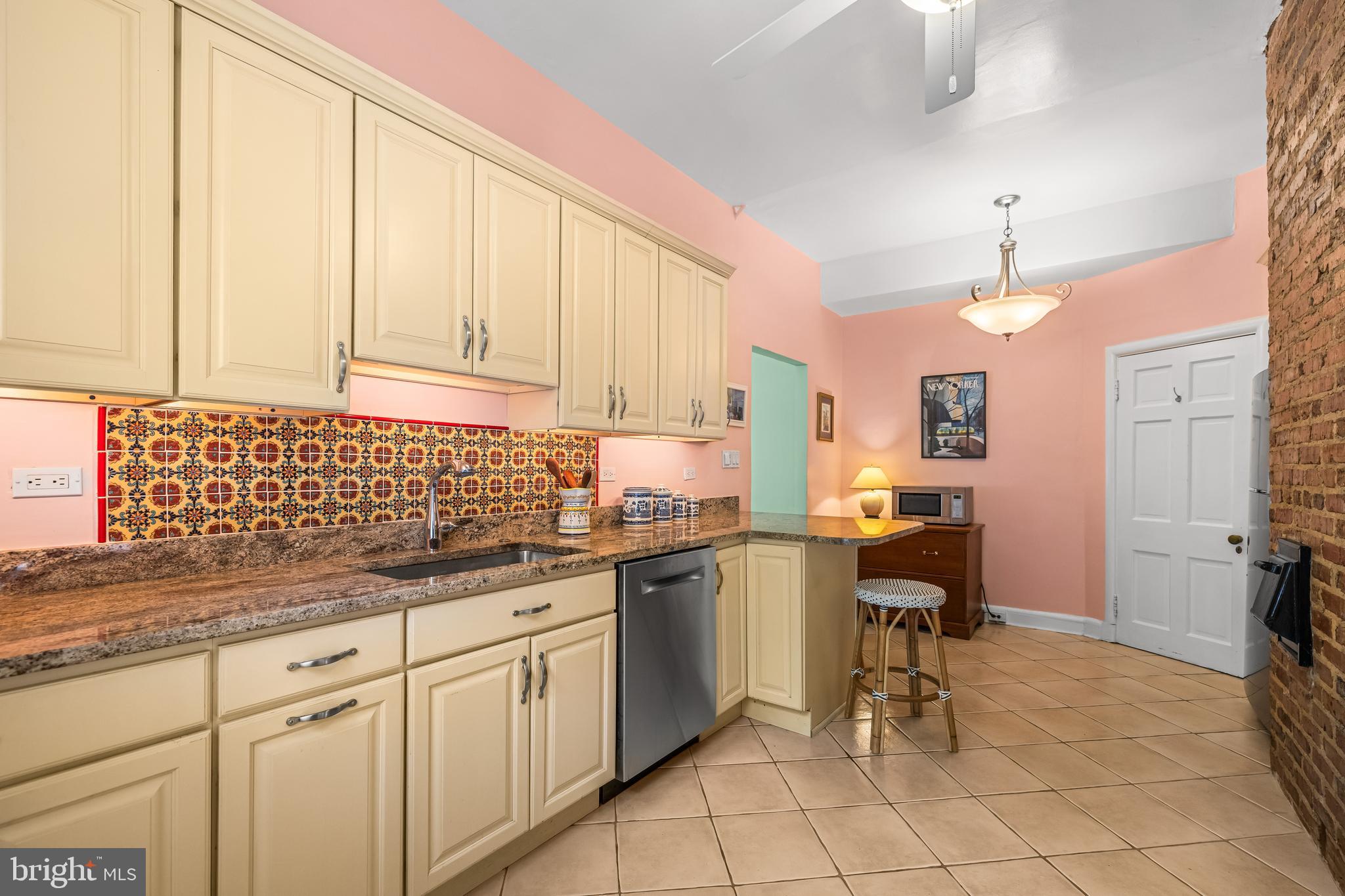 6 Upland Road, Unit F1 Baltimore, MD 21210 - Photo 22 of 50 a kitchen with cabinets and chairs
