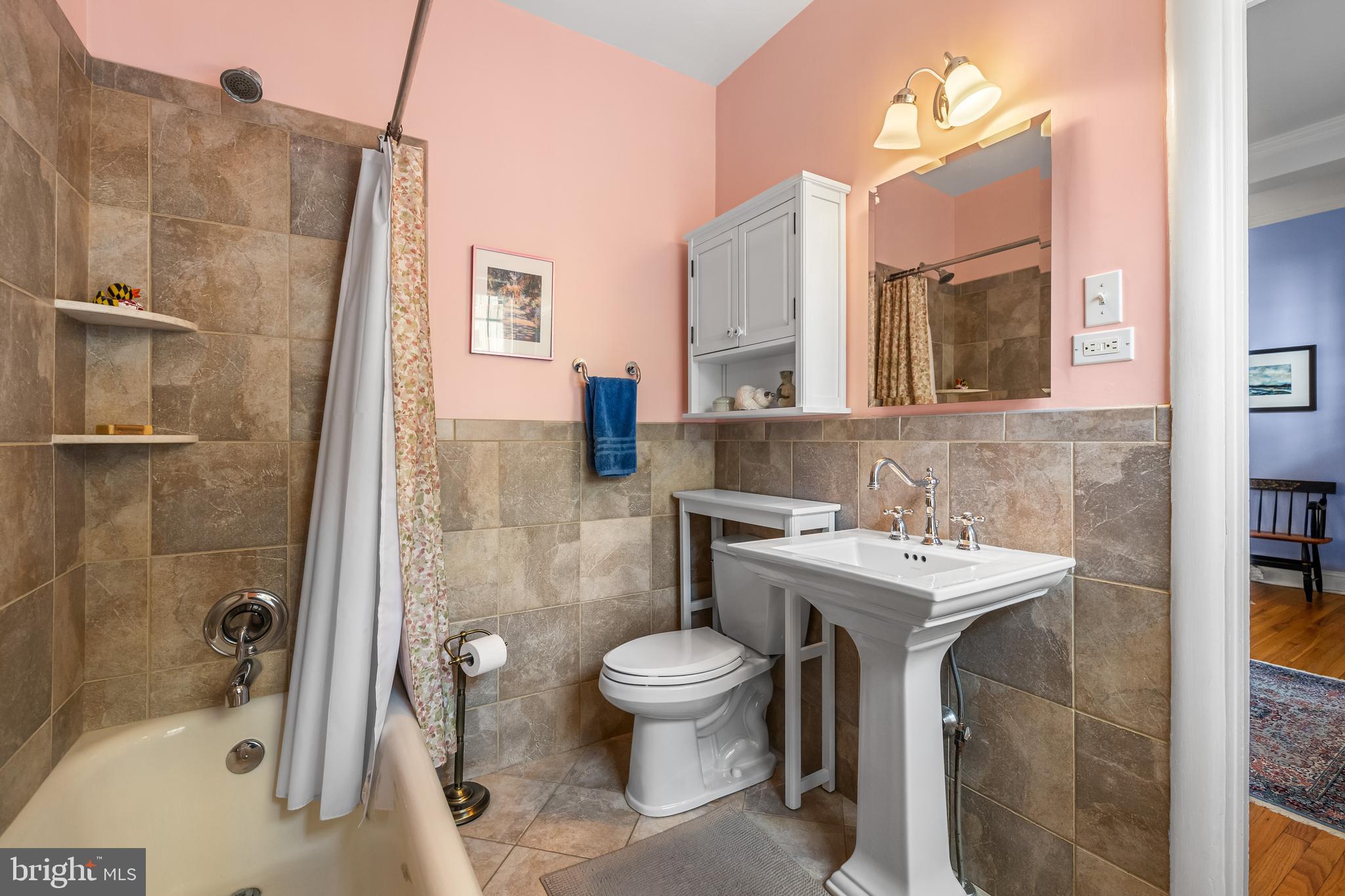 6 Upland Road, Unit F1 Baltimore, MD 21210 - Photo 29 of 50 a bathroom with a sink toilet and shower